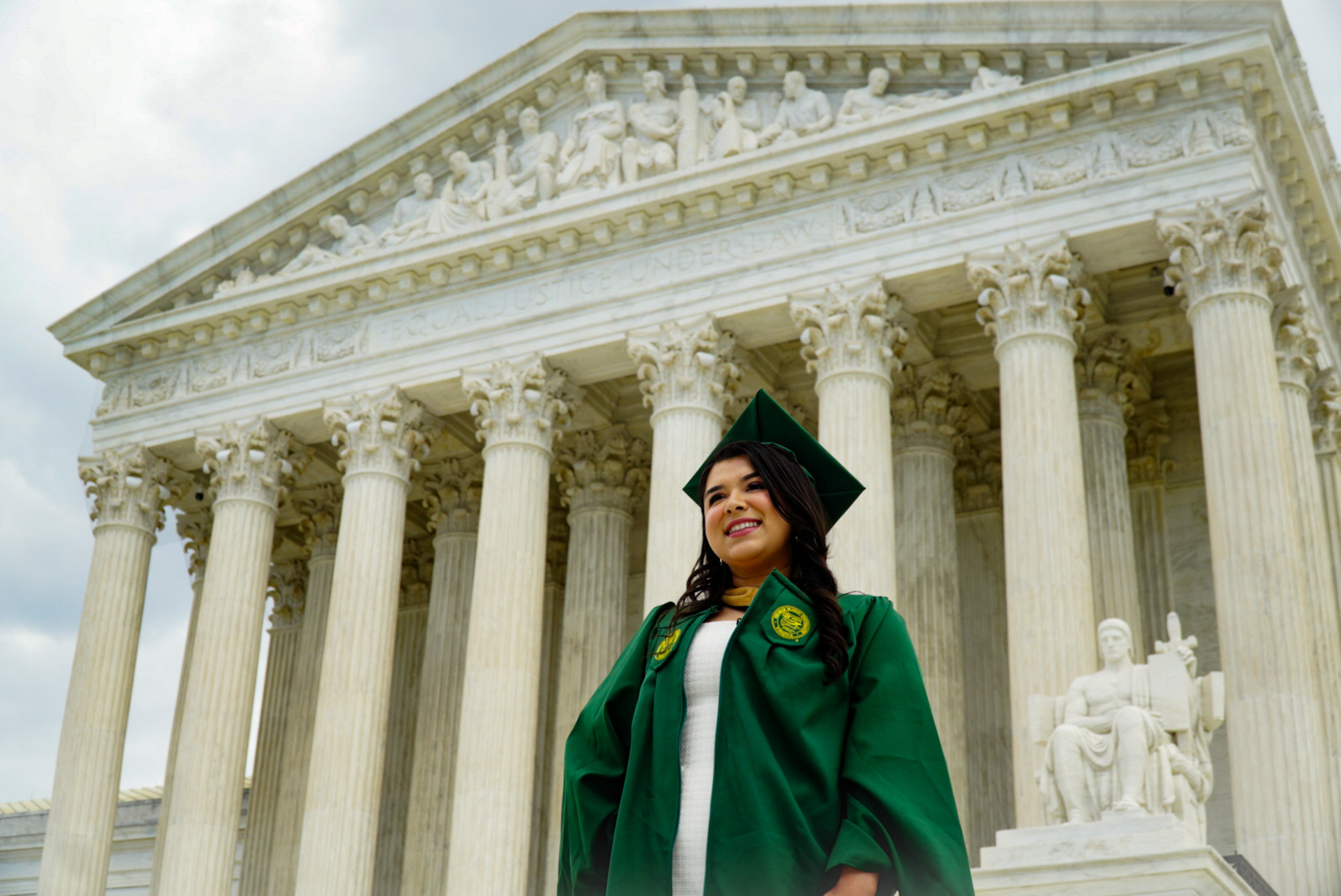 Graduate celebrating in cap and gown
